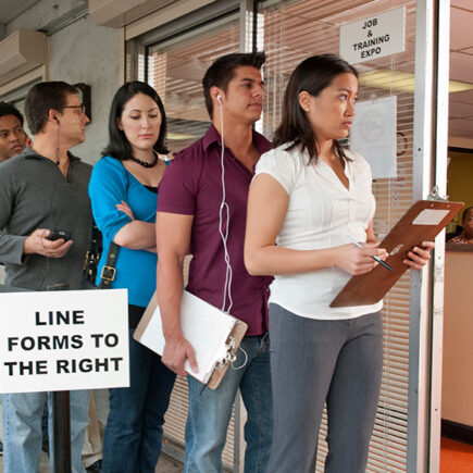 Photo: People standing in line for job & training expo