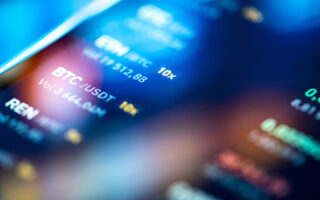 Decorative photo: Close-up financial trading chart on digital LCD display of BTC bitcoin.
