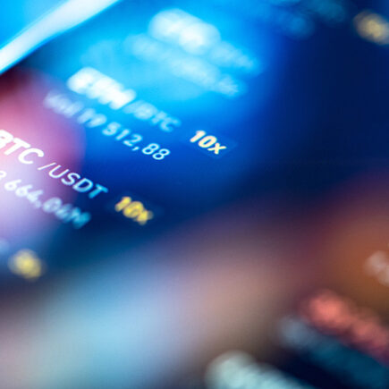 Decorative photo: Close-up financial trading chart on digital LCD display of BTC bitcoin.