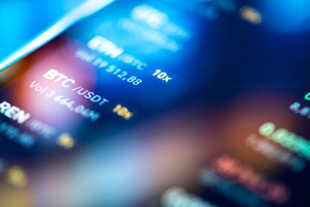 Decorative photo: Close-up financial trading chart on digital LCD display of BTC bitcoin.
