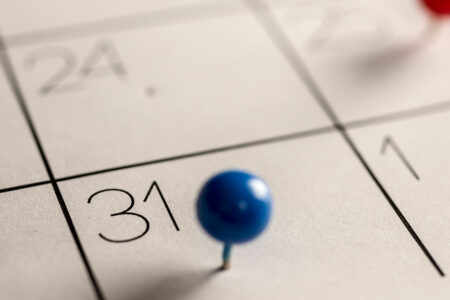Decorative Image: Portion of a calendar focusing on the 31st with a blue pushpin image