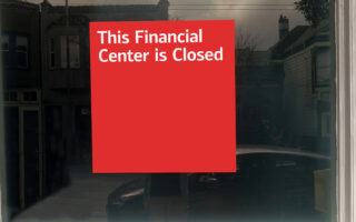 Photo: Red sign with white lettering on window that says: This Financial Center is Closed".