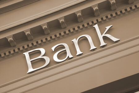 Photo: generic image of the word Bank on an old building facade.