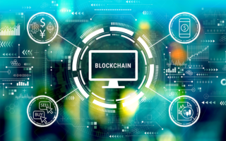 Decorative image: blockchain with spokes including cryptocurrency, mobile $, buy/sell icons. Cryptocurrency fintech theme with big city lights at night.