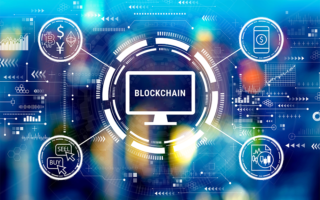 Decorative image: blockchain with spokes including cryptocurrency, mobile $, buy/sell icons. Cryptocurrency fintech theme with big city lights at night.