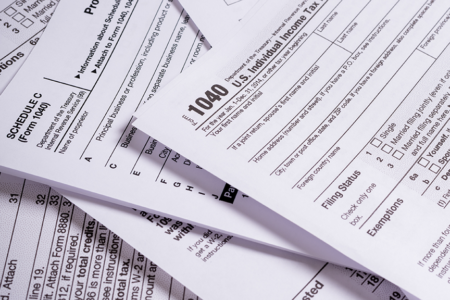 Photo: U.S. individual income tax forms 1040 and schedule c.