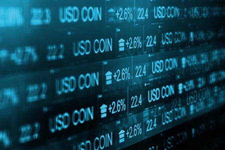 Photo of USD Coin price ticker with up arrows on +2.6% 22.4.