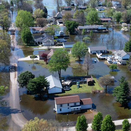 An aerial view shows floodwater surrounding homes on April 07, 2025 in East Prairie, Missouri. Thunderstorms, heavy rains, high winds and tornadoes have plagued the region for the past several days, causing widespread damage before moving east. (Photo by Scott Olson/Getty Images)