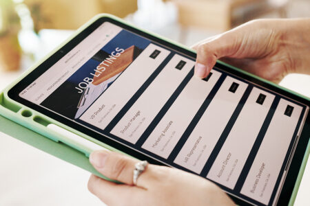 Photo: Hands, person and tablet screen for job search on website, vacancy listings and contact us of recruitment process. Digital, resume app and online for hiring service, application post and opportunity.
