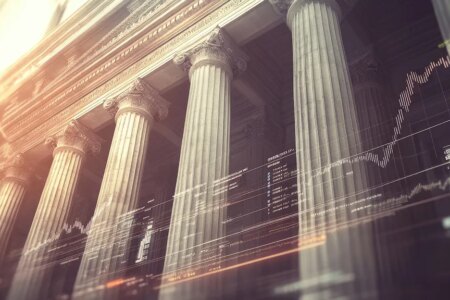 Financial stability: A classic bank building with columns, financial symbols, and charts, representing the concept of financial stability and security.