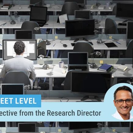 Street level column by Research Director Kartik Athreya. Image of Athreya on top of a photo of a large room with rows of desks and laptops with only one man sitting at one desk working.