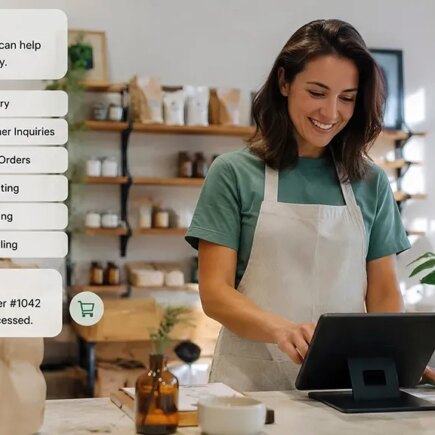 AI generated image of small businesswoman looking at her computer screen and on the image is the AI response on how it can help her with online orders, inventory, customer inquiries, etc.