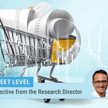 descriptive image of a toy shopping cart filled with receipts on a turquoise background. photo of research director Kartik Athreya on the bottom of the image.